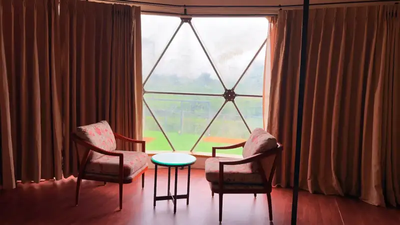 Duplex Dome king-size bed with forest views